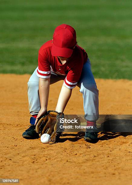 Baseball Player Scoops Up Ball Stock Photo - Download Image Now - Baseball - Ball, Sports Ball, Child