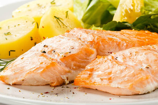 istock roasted salmon, boiled potatoes and vegetables 139747606