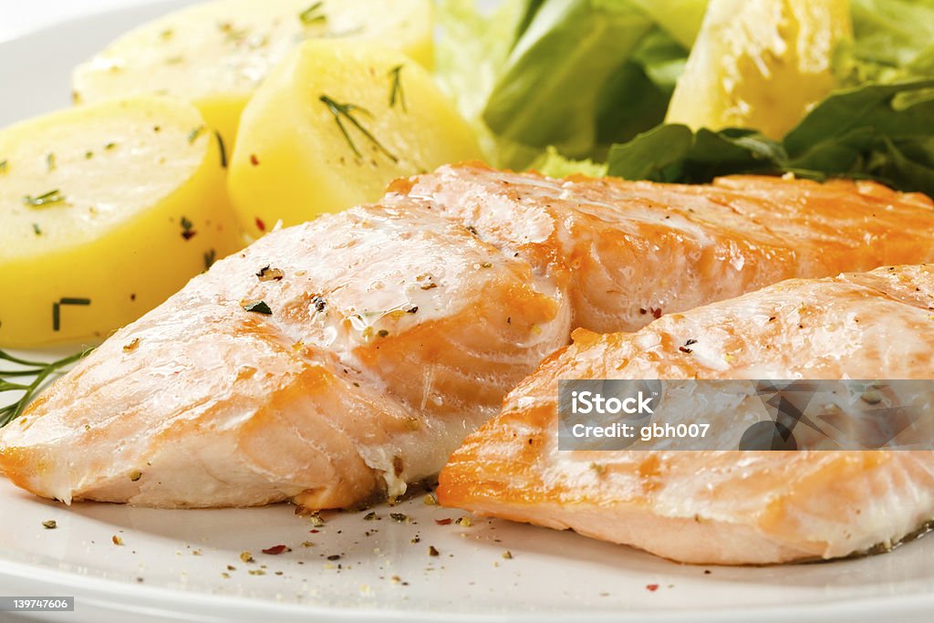 roasted salmon, boiled potatoes and vegetables Fish dish Baked Salmon Stock Photo