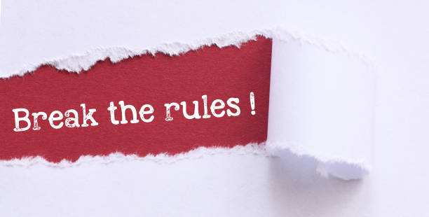 istock BREAK THE RULES! words on a red sheet and a light background. Concept for innovation, creativity or mischief 1397476064