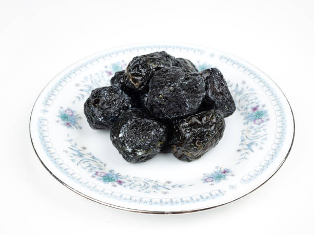 istock Chinese Smoked Plum on White Background 1397476109