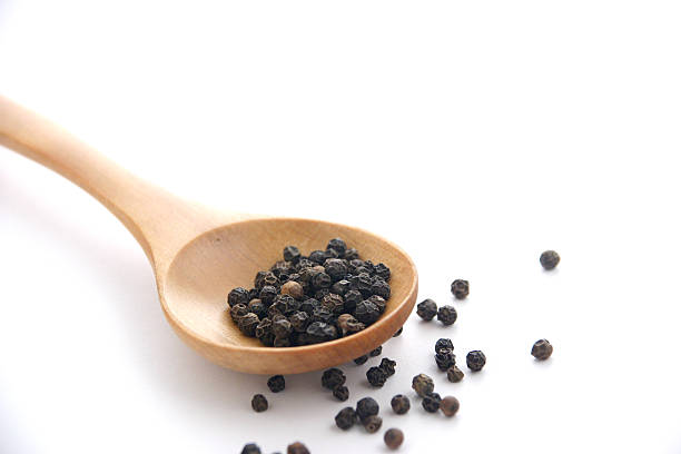 istock Wooden Spoon of  Pepper on White 139747639