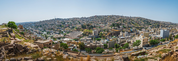 Amman skyline panorama in Jordan. Sunny day view of the old downtown of Jordanian capital city built on seven hills
