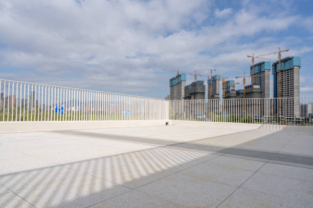 istock An empty stone square and the city skyline in the distance 1397477410
