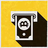 istock Bitcoin withdrawal. Icon with long shadow on textured yellow background 1397477591