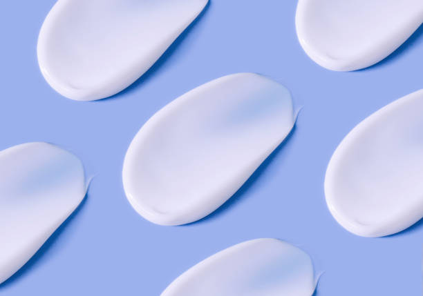 istock pattern of smears of white cream on a light pastel background 1397479260