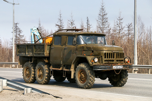Novyy Urengoy, Russia - May 14, 2022: Old Soviet offroad truck ZIL 131 in a city street.