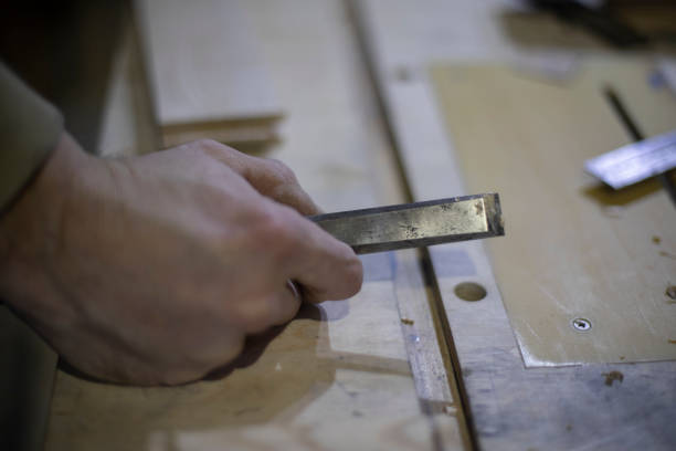 istock Cutter in hand of carpenter. Wood cutting tool. 1397479534