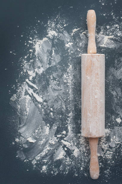 istock rolling pin with flour on a dark table. Chicken background. Cooking. Bakery 1397479697