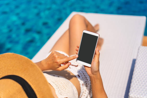 istock Young woman traveler using phone while traveling on summer vacation 1397482142