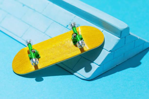 istock Yellow fingerboard and plaster ramp on a blue background 1397483528