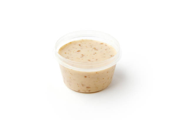 istock Natural sesame sauce in plastic jar isolated on white 1397483571