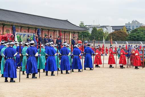 Seoul, South Korea - October 9, 2017: Performance with historical reconstruction at courtyard of Gyeongbokgung Palace. Royal guards wearing the Jeonbok, Korean traditional military clothing.
