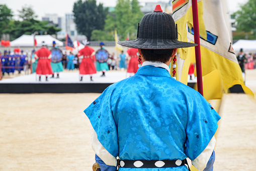 Seoul, South Korea - October 9, 2017: Performance with historical reconstruction at courtyard of Gyeongbokgung Palace. Royal guards wearing the Jeonbok, Korean traditional military clothing.