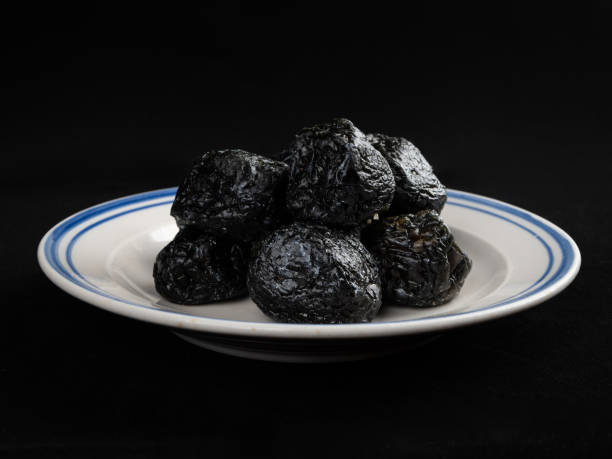 istock Chinese Smoked Plum on Black Background 1397484725