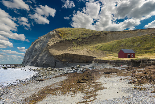 Red fisherman's cottage near the coast in the small village Cameron. Tierra del Fuego, Chile