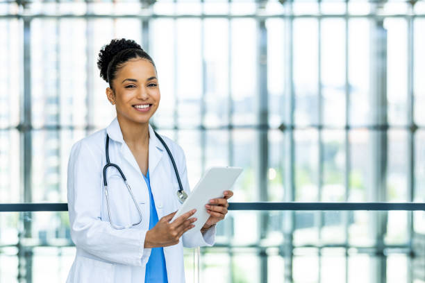 istock Smiling doctor at her clinic 1397485614