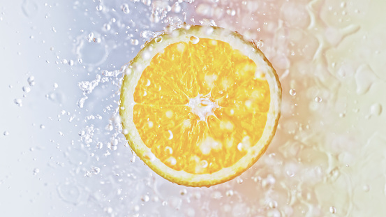 Close-up of half lemon fruit in water against white background.