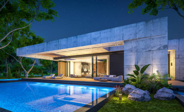 istock 3d rendering of new concrete house in modern style in night 1397488895