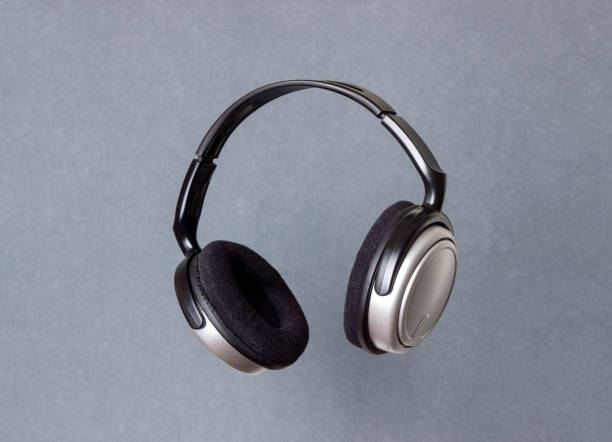 istock Headphones on a silver background. Minimal concept. Mock-up. Music. Levitation. 1397489266