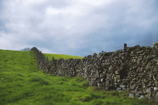 istock Hills and stone fence in England 1397491224