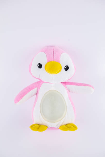 istock pink penguin children's soft toy on a white background 1397491819
