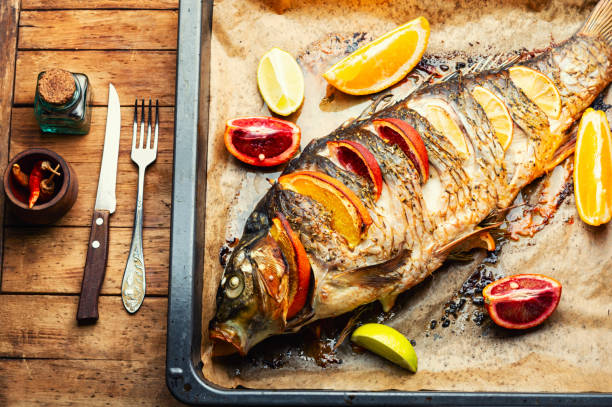 istock Whole baked carp with citrus fruits. 1397496308