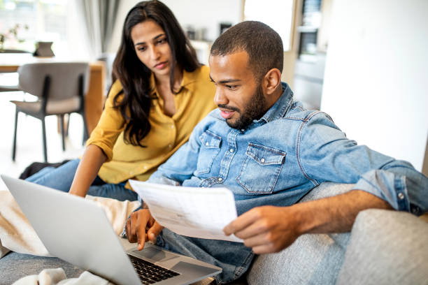 Young couple planning their finances together stock photo