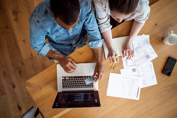 istock Young couple planning their finances together 1397496436