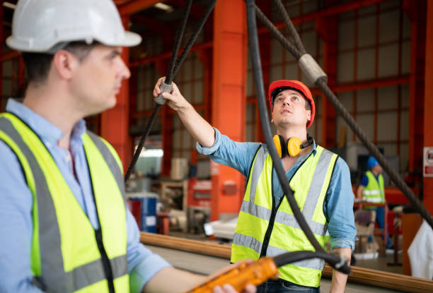 istock Two young engineers Testing and checking the operation of the semi gantry crane 1397499209