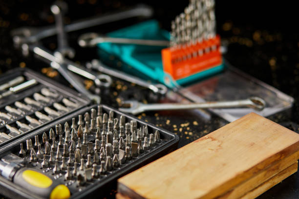 A box of metal steel heads and bits with different types for screwdriver in the workshop A box of metal steel heads and bits with different types for screwdriver in the workshop drill bit stock pictures, royalty-free photos & images