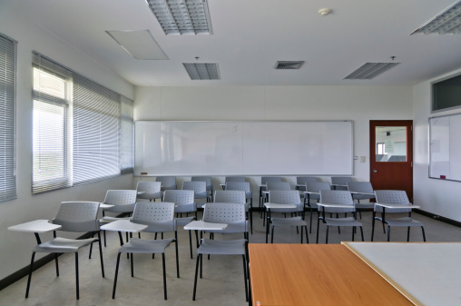Empty classroom with chairs and white board
