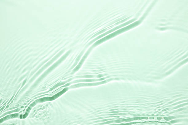 istock The texture of water on a green background. 1397500868