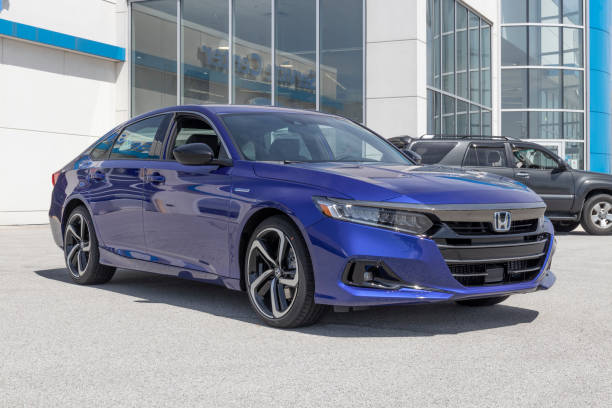Honda Accord Hybrid display at a dealership. The Honda Accord is one of the top 25 cars sold in the US every year. stock photo
