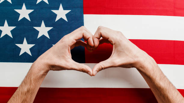 istock hand in heart shape on american flag 1397501852