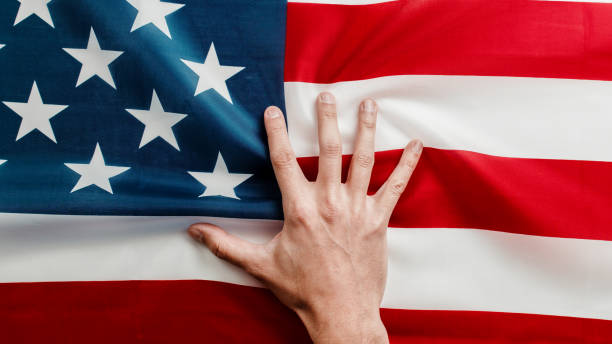 istock hand on american flag close up 1397501853