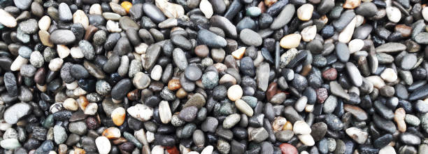 istock boulder pebble beach stones background seamless texture for design use, Naturally rounded gravel at sea shore Nature background texture pattern 1397502203