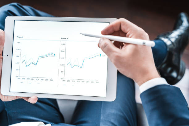 istock Businessman looking at financial data on digital tablet 1397502650