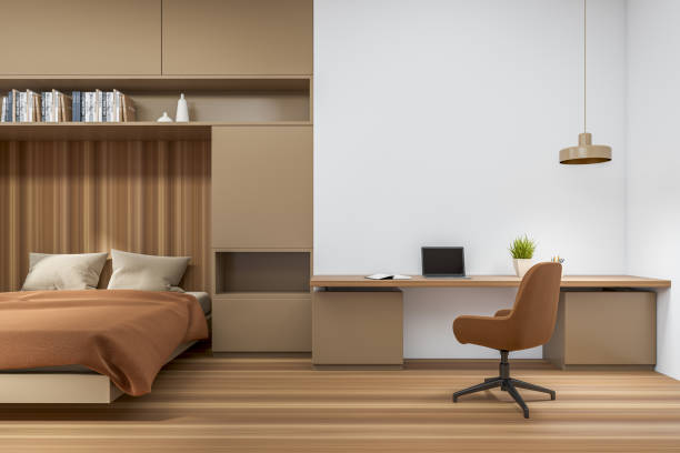 istock Wooden hotel interior with bed and desk with computer. Mockup 1397503859