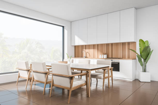 istock Light dining interior with table and chairs, cooking area and panoramic window 1397504263