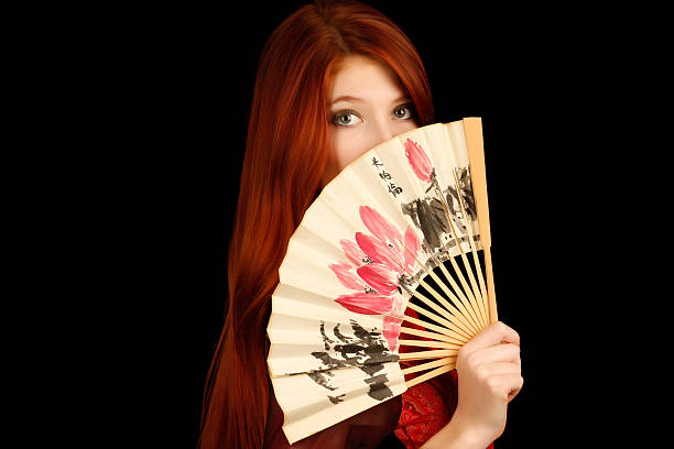 Girl holding a fan