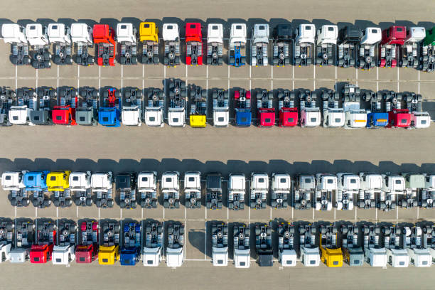 istock Trucks in a row at a parking lot seen from above 1397504840
