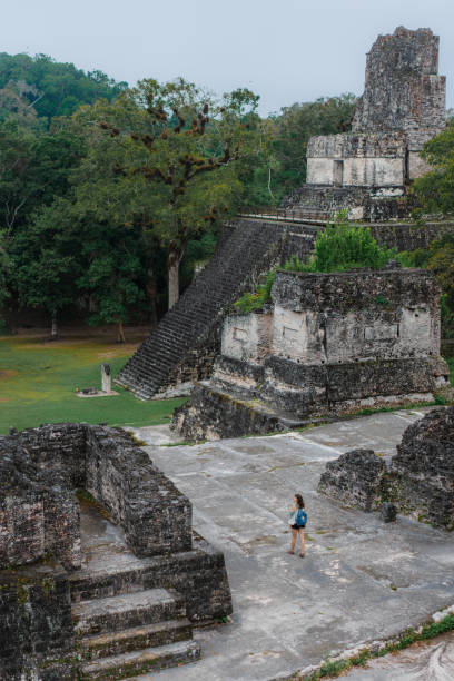 istock Woman exploring Tikal National Park 1397506498