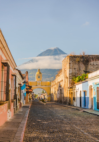 Scenic view of Antigua city on the background of Agua volcano at sunrise, Guatemala