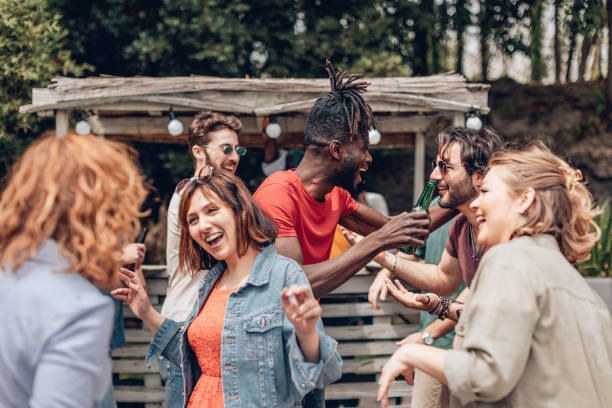 istock multiethnic young people interacting talking dancing with joy at the summer outdoor evening party - spanish movida american clubbing european happy hour concept 1397508115