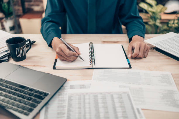 istock Investors working on desk office and using a pan and pointing to check tracking cost, balance, profit and  currency. Accounting and  Financial concept. 1397508862