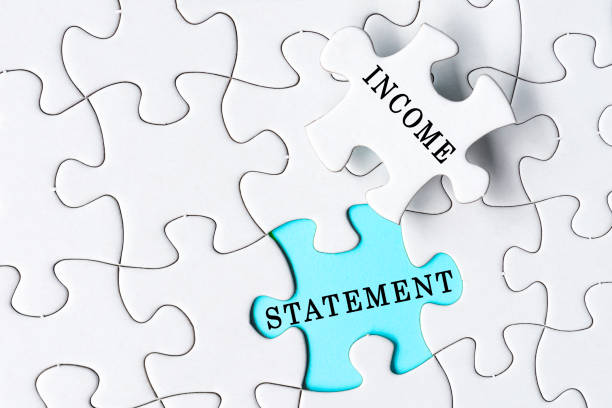 istock White jigsaw puzzle with word income statement over blue background. 1397509155