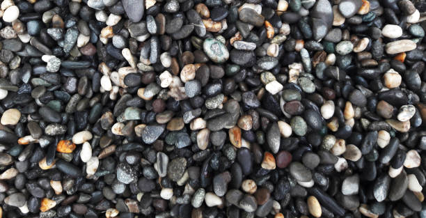 istock boulder pebble beach stones background seamless texture for design use, Naturally rounded gravel at sea shore Nature background texture pattern 1397509180