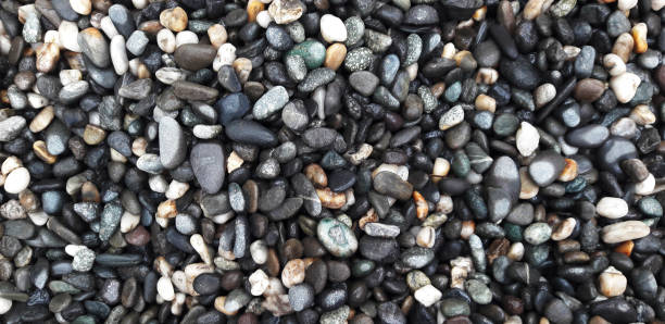istock boulder pebble beach stones background seamless texture for design use, Naturally rounded gravel at sea shore Nature background texture pattern 1397509272