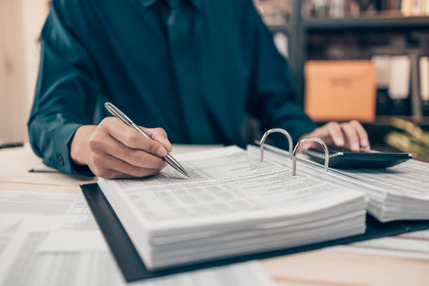 istock Investors working on desk office and using a pan and pointing to check tracking cost, balance, profit and  currency. Accounting and  Financial concept. 1397509317